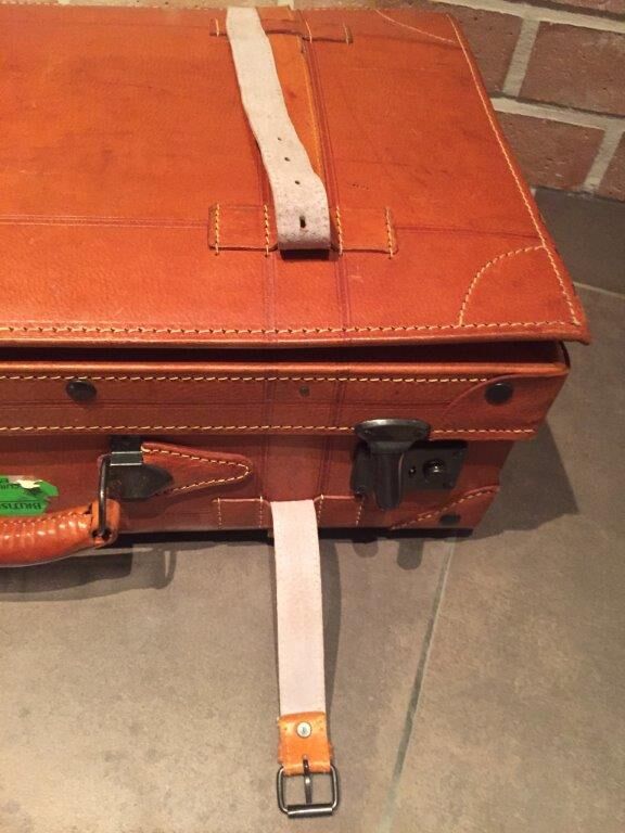 Thick leather suitcase