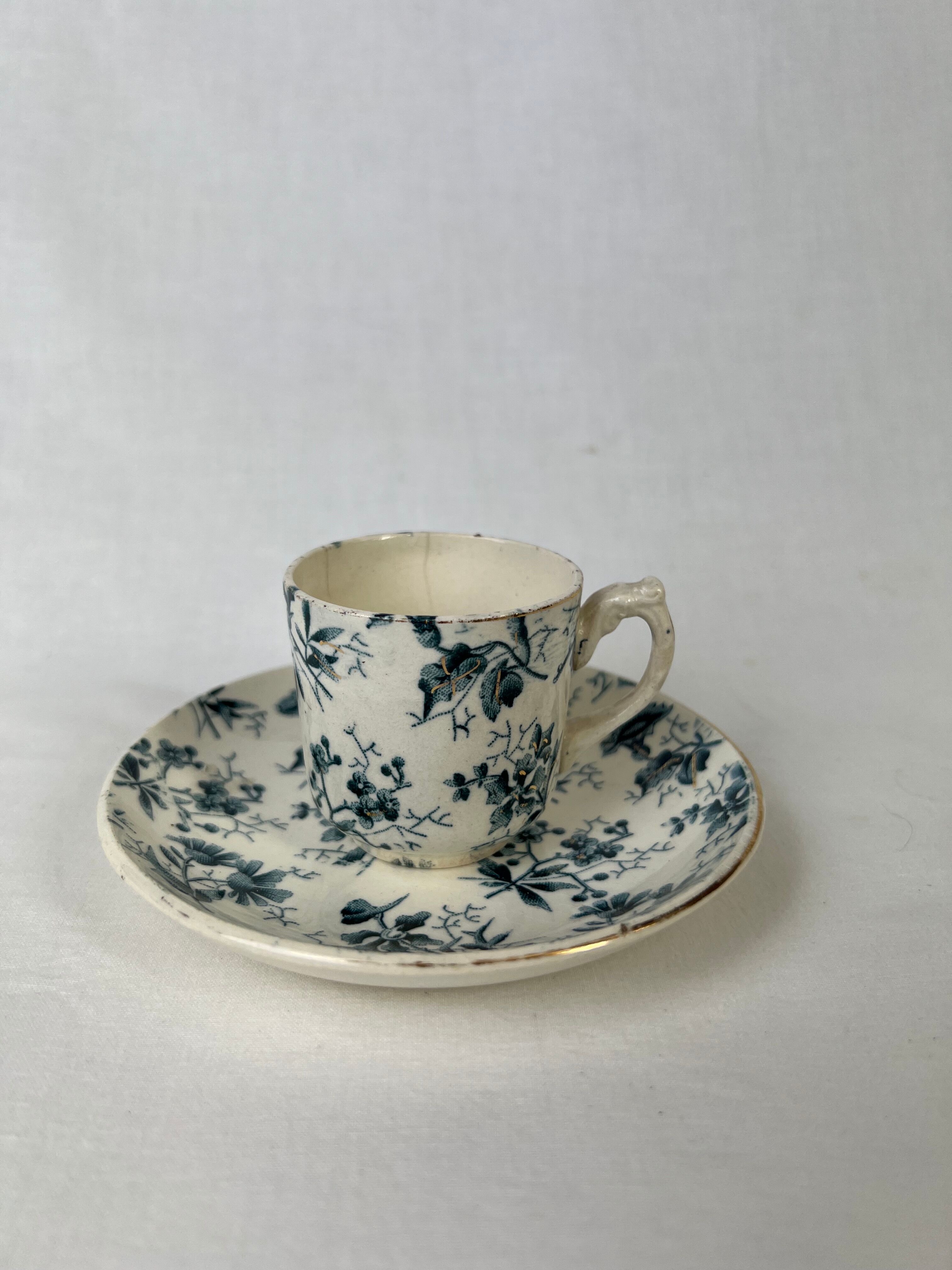 White porcelain cup with blue flowers