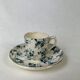 White porcelain cup with blue flowers