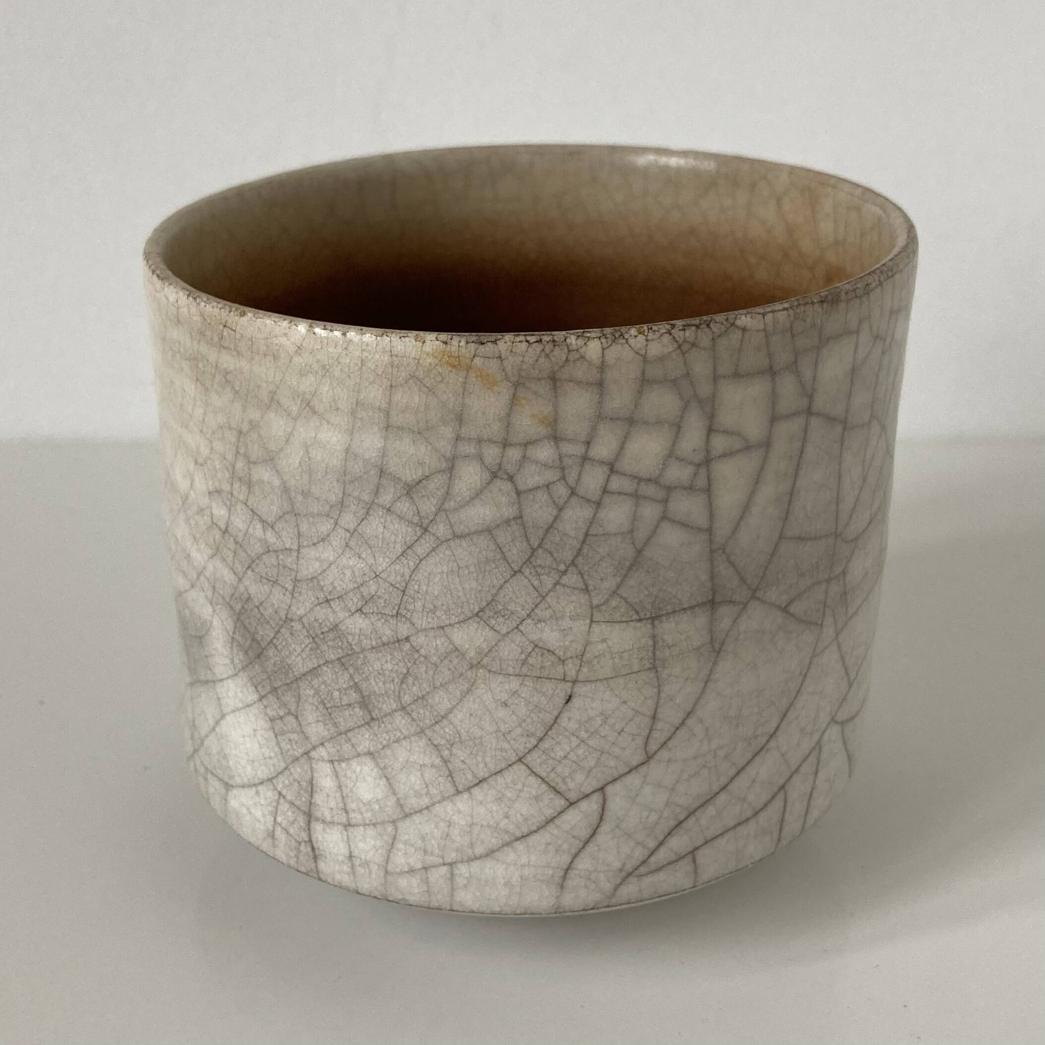 Traditional raku ceramic tea or matcha bowl with mark on the base