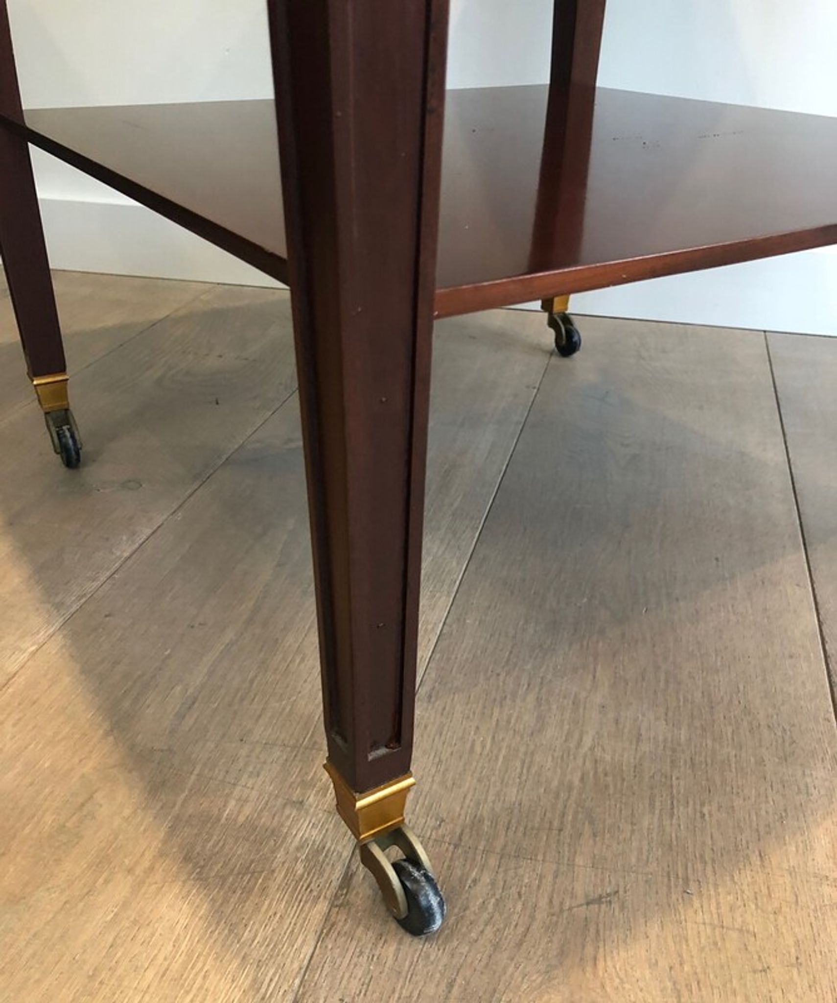 Two-level table in mahogany and brass