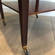 Two-level table in mahogany and brass