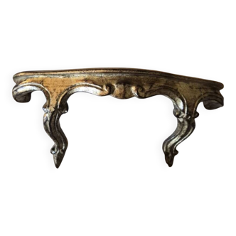 Golden wooden stool in the Louis XV style.