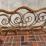 Vintage 2-person rattan headboard bed