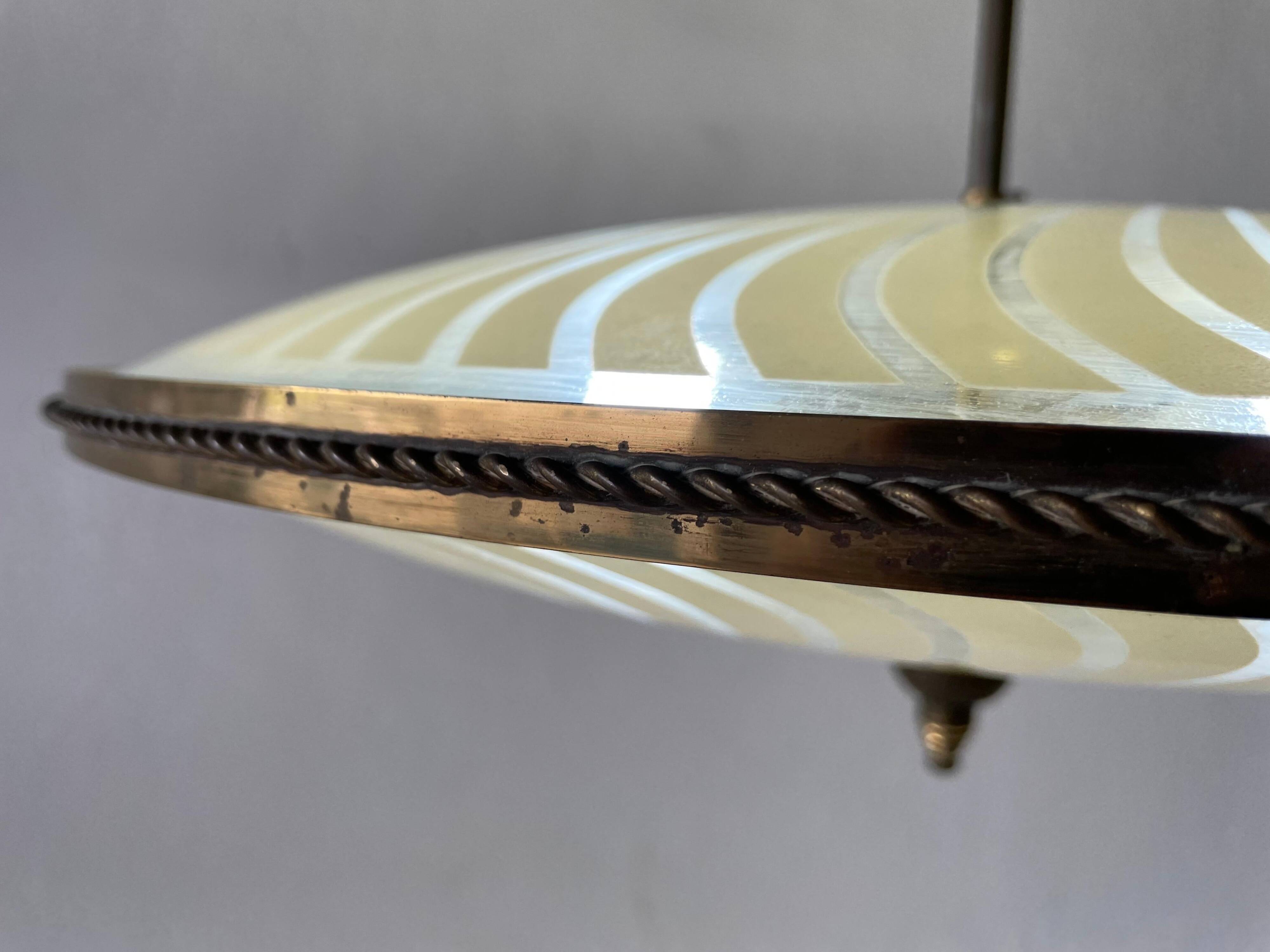 Large UFO design ceiling light in brass and printed glass, 1950s, Italy.