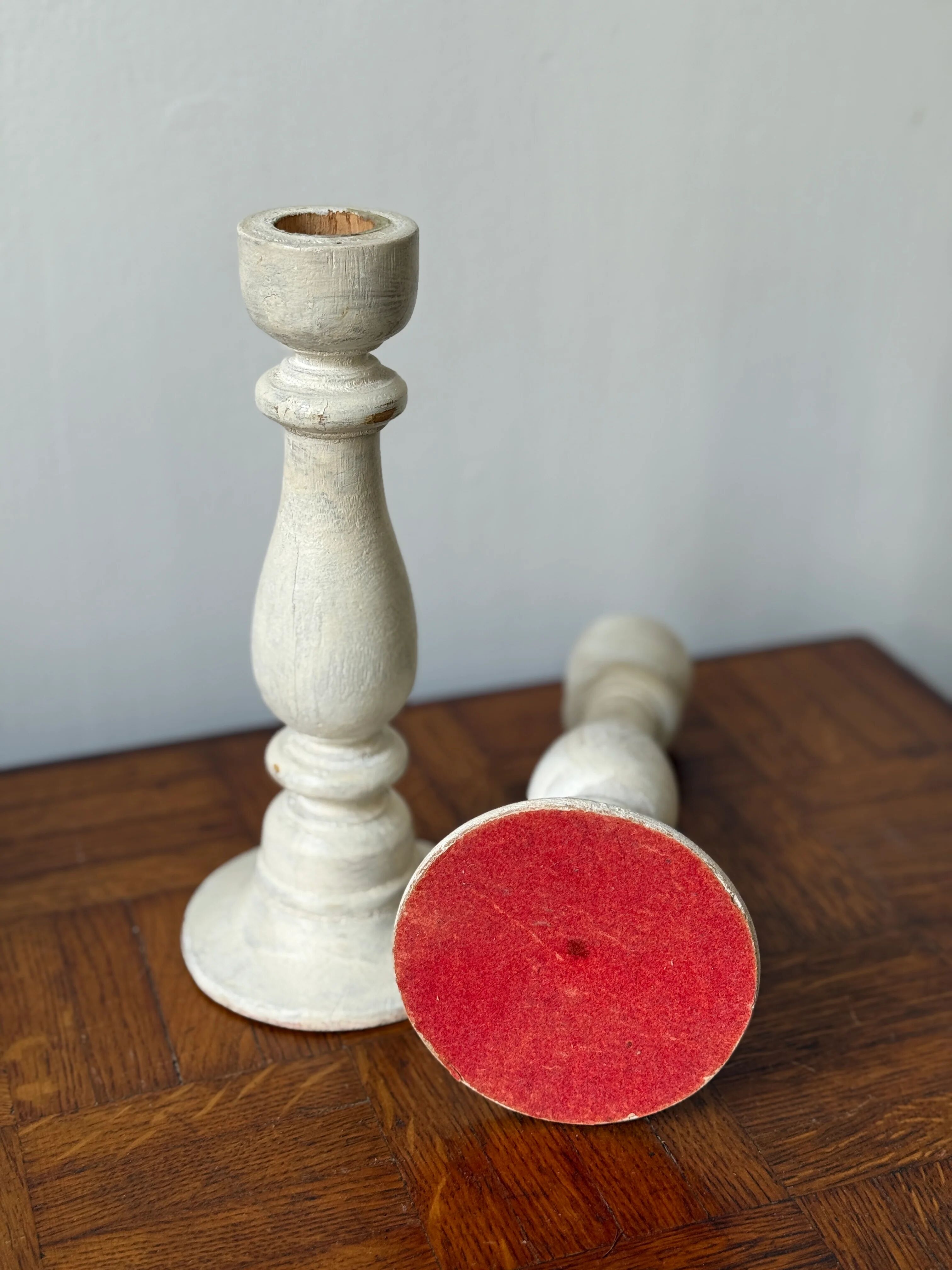 Pair of white wooden candlesticks