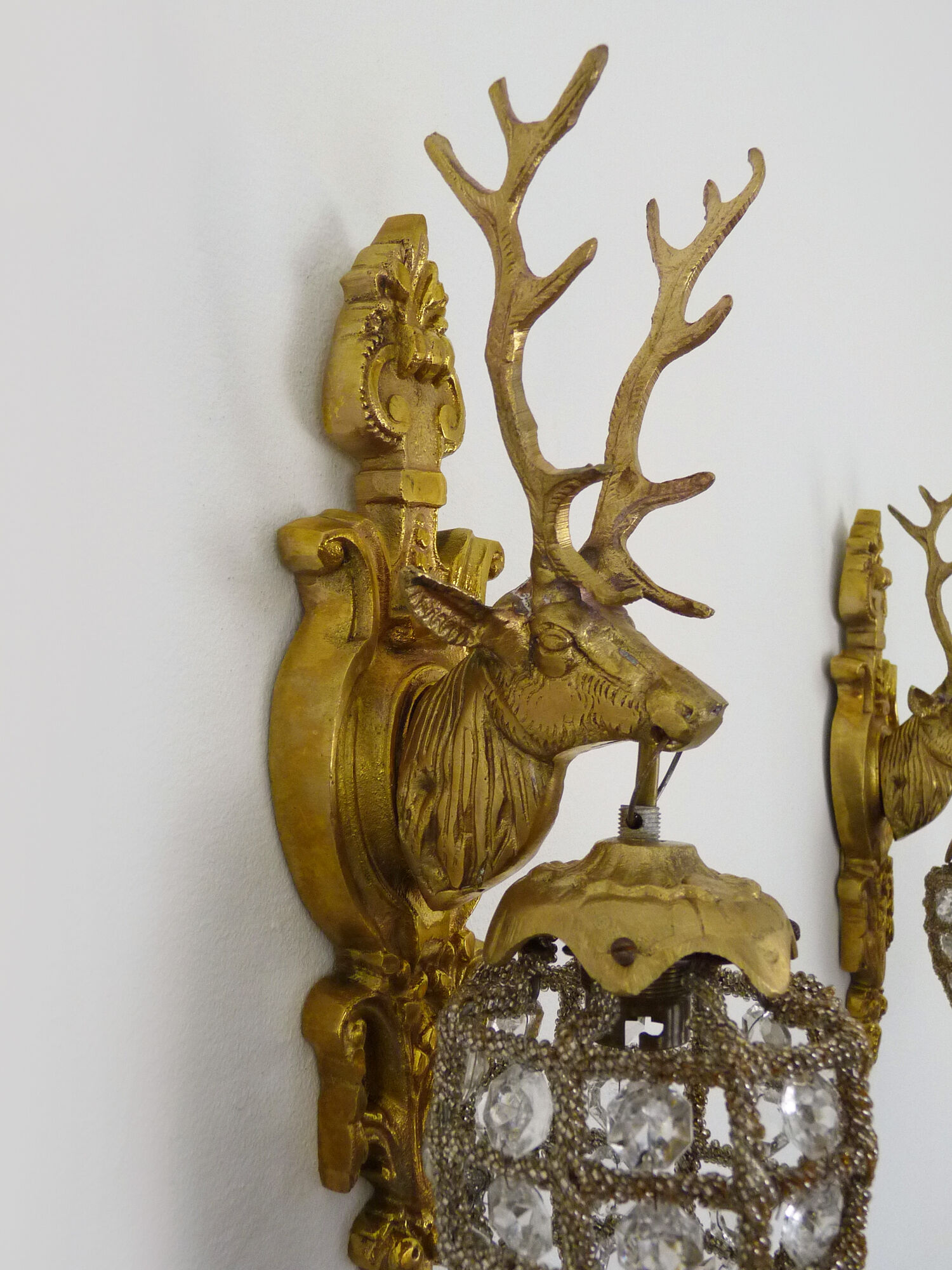 Pair of vintage wall lamps with pearl deer head and glass grapevines