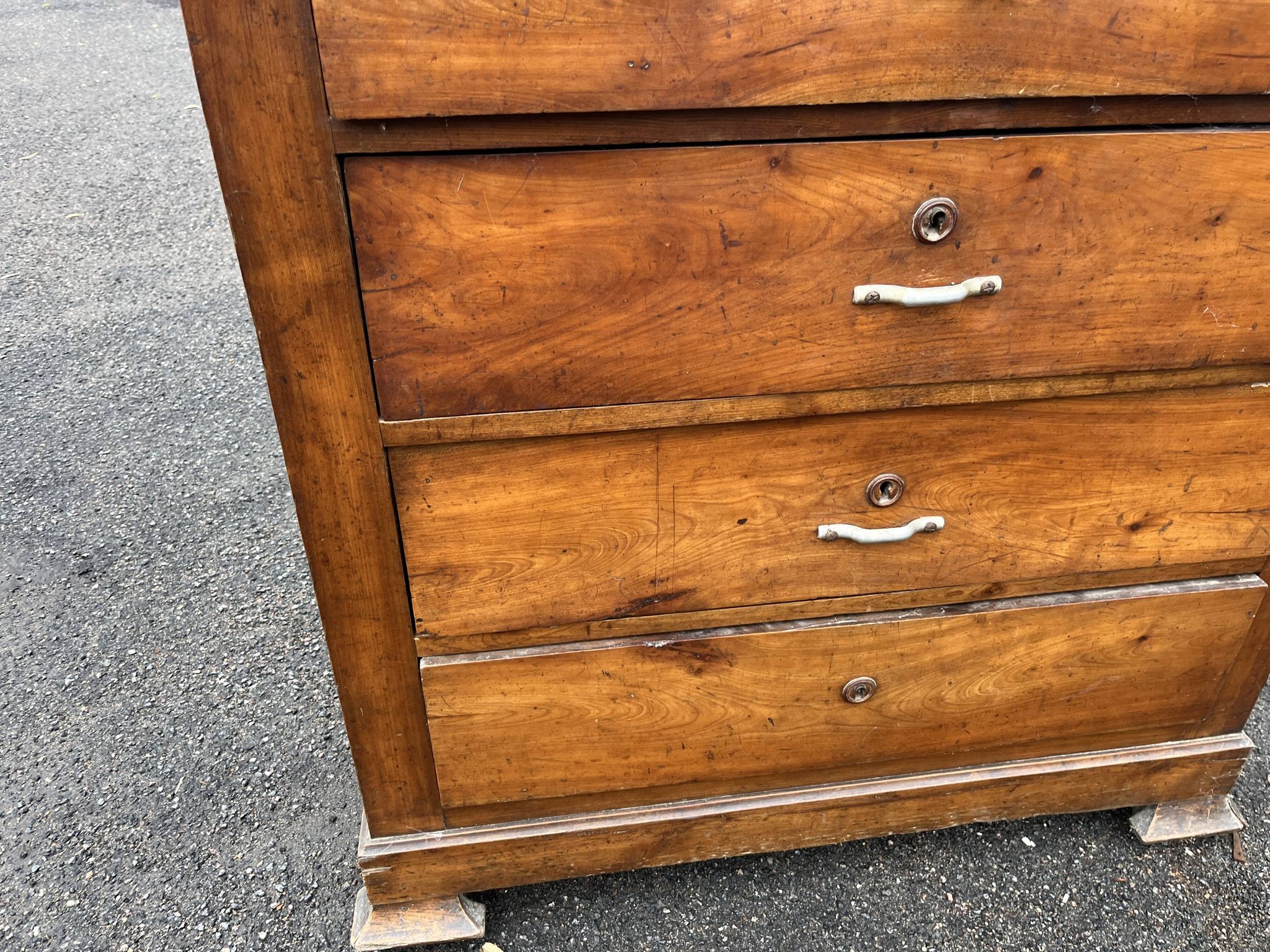 Antique 19th-century wooden chest of drawers with a marble top