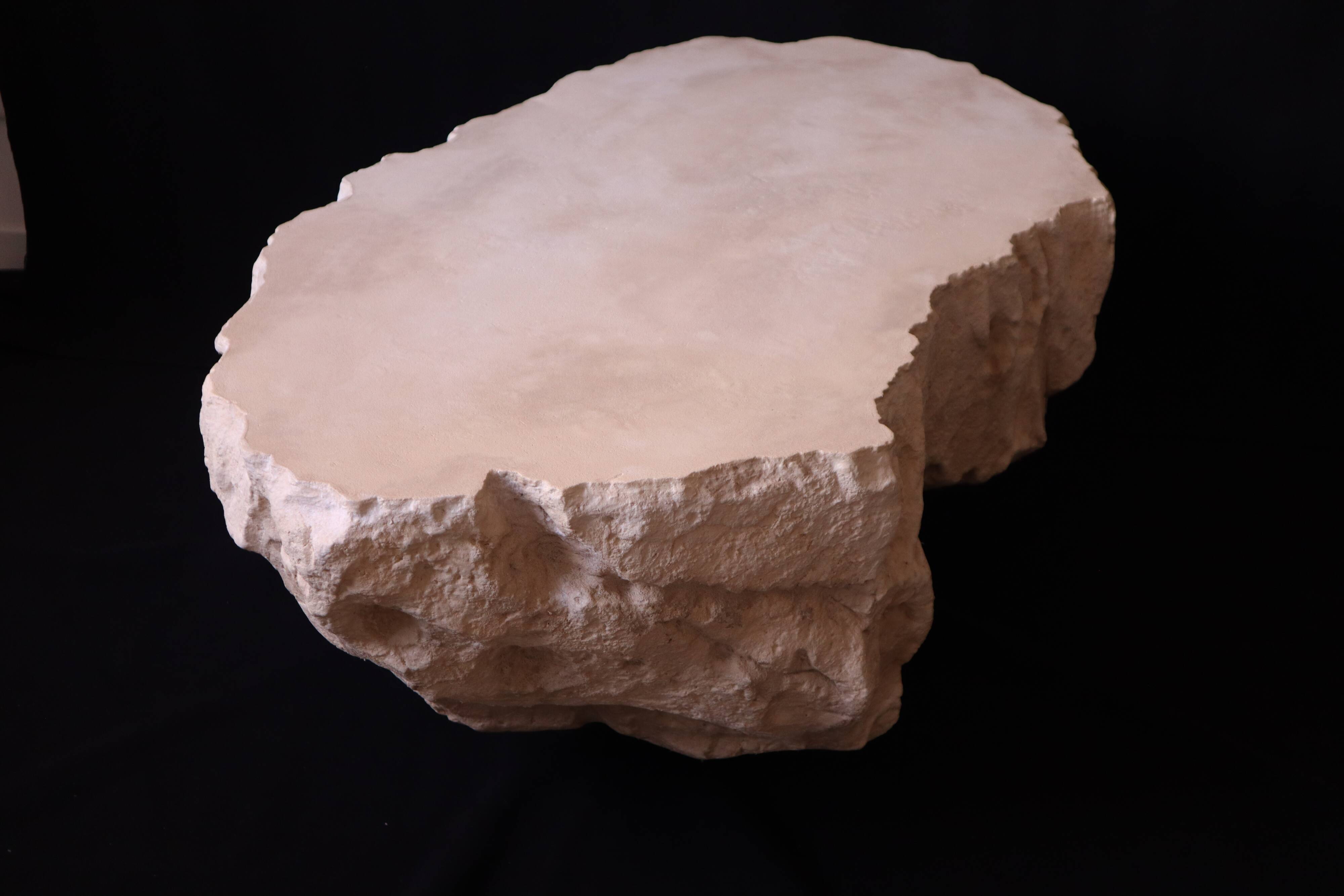 Designer coffee table with travertine rock effect — unique handcrafted piece.