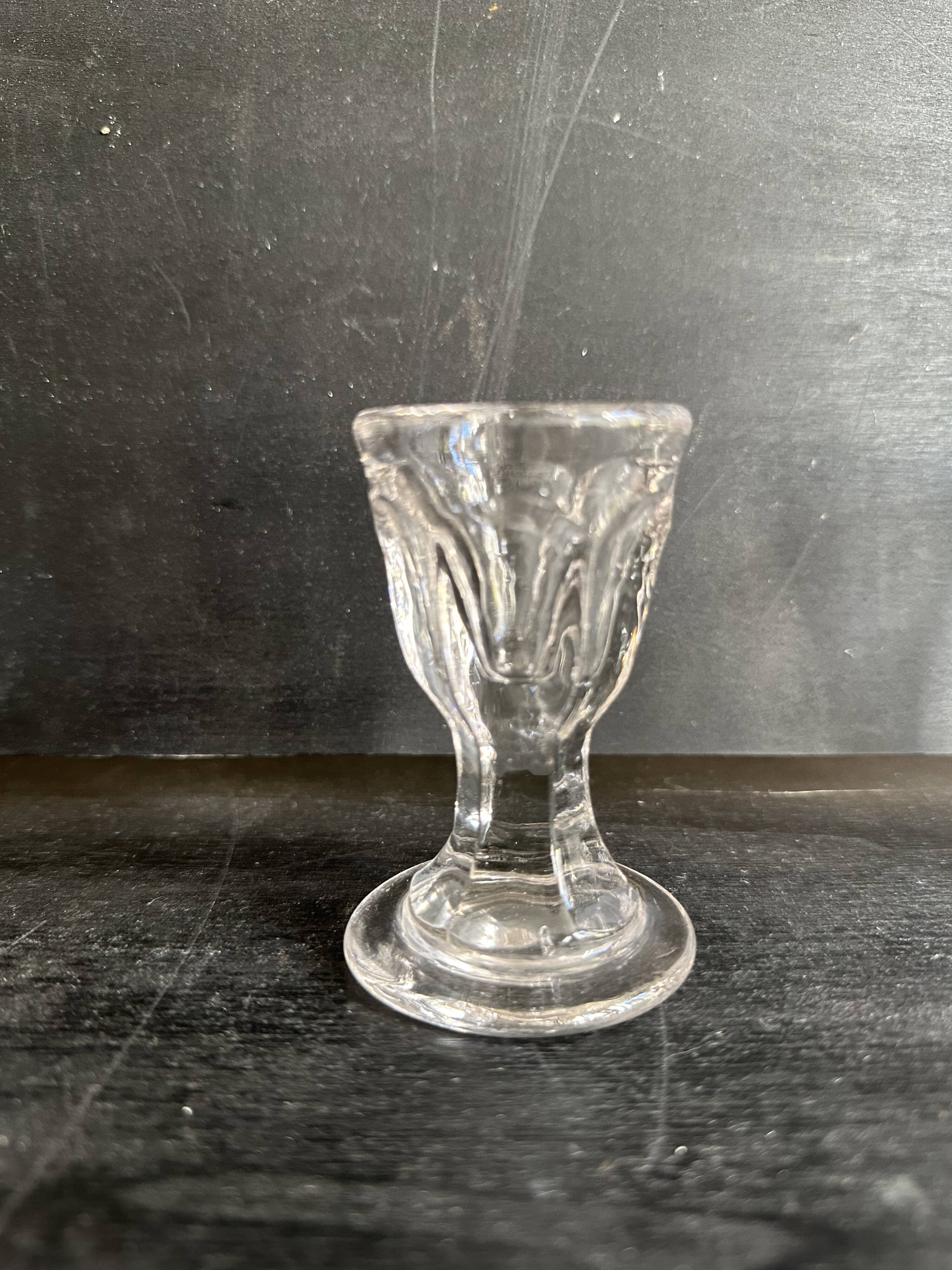 Set of antique liqueur glasses in thick glass, bistro style.