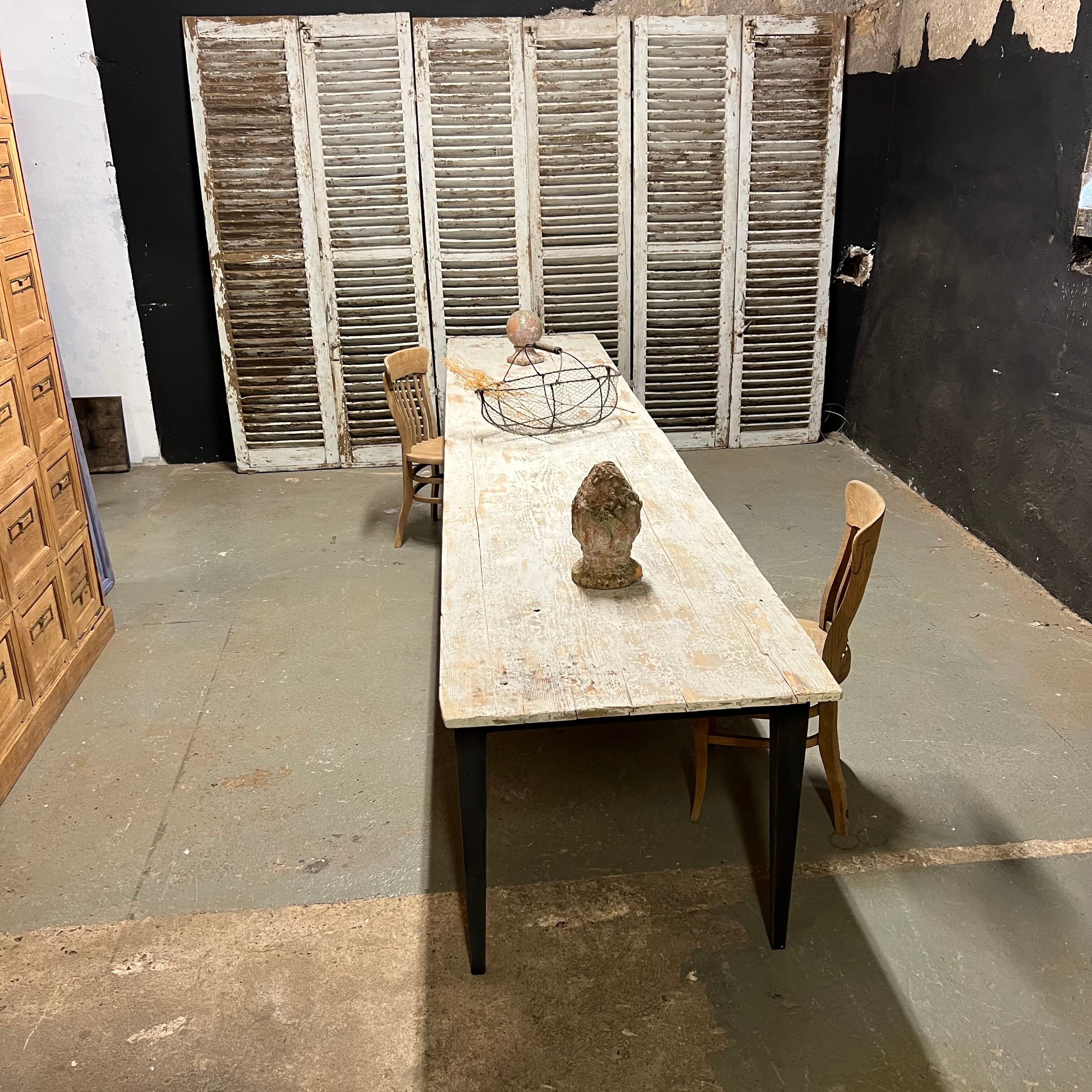 Black farmhouse table and white patinated top