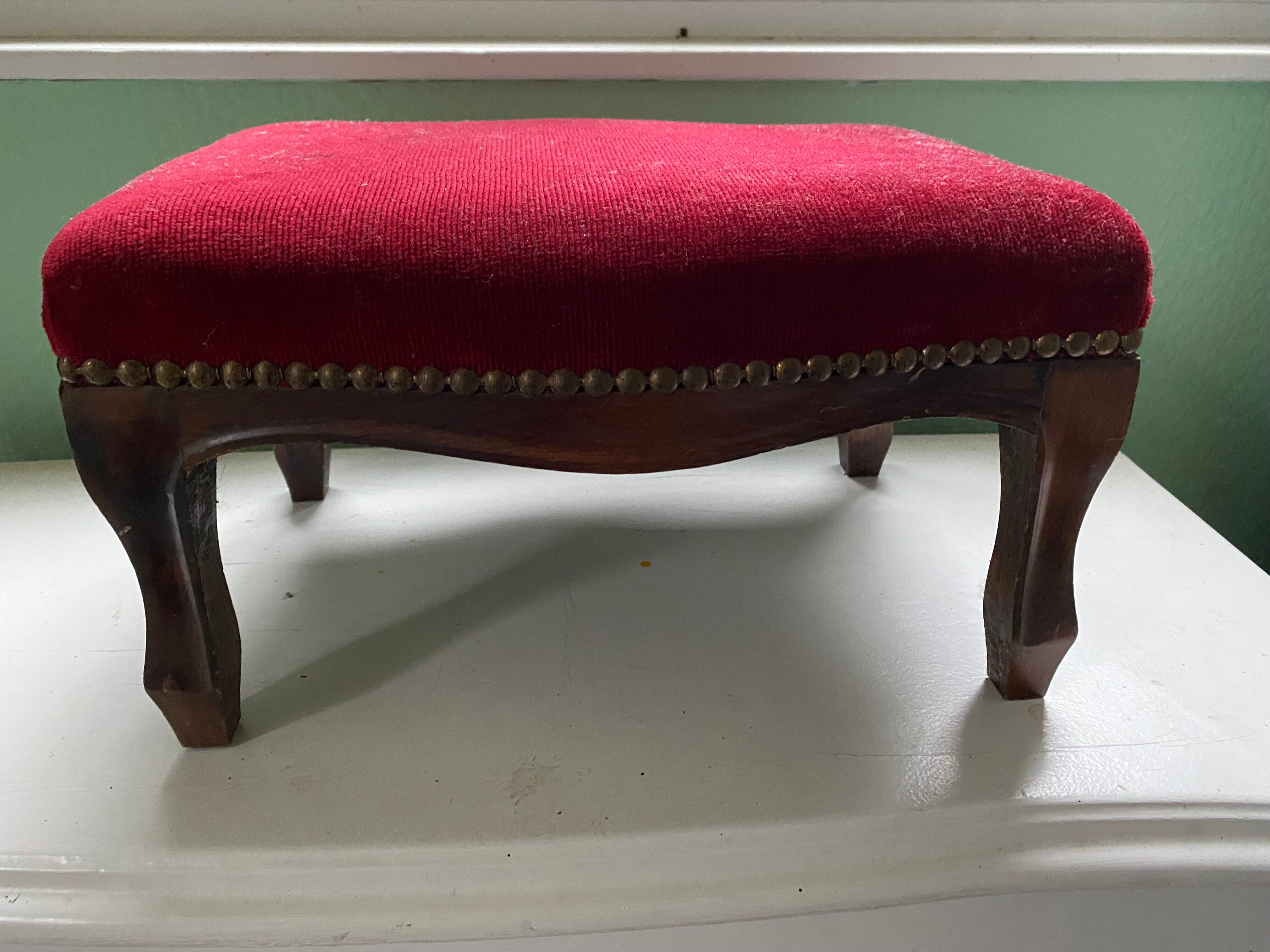 Wooden footrest and red velvet