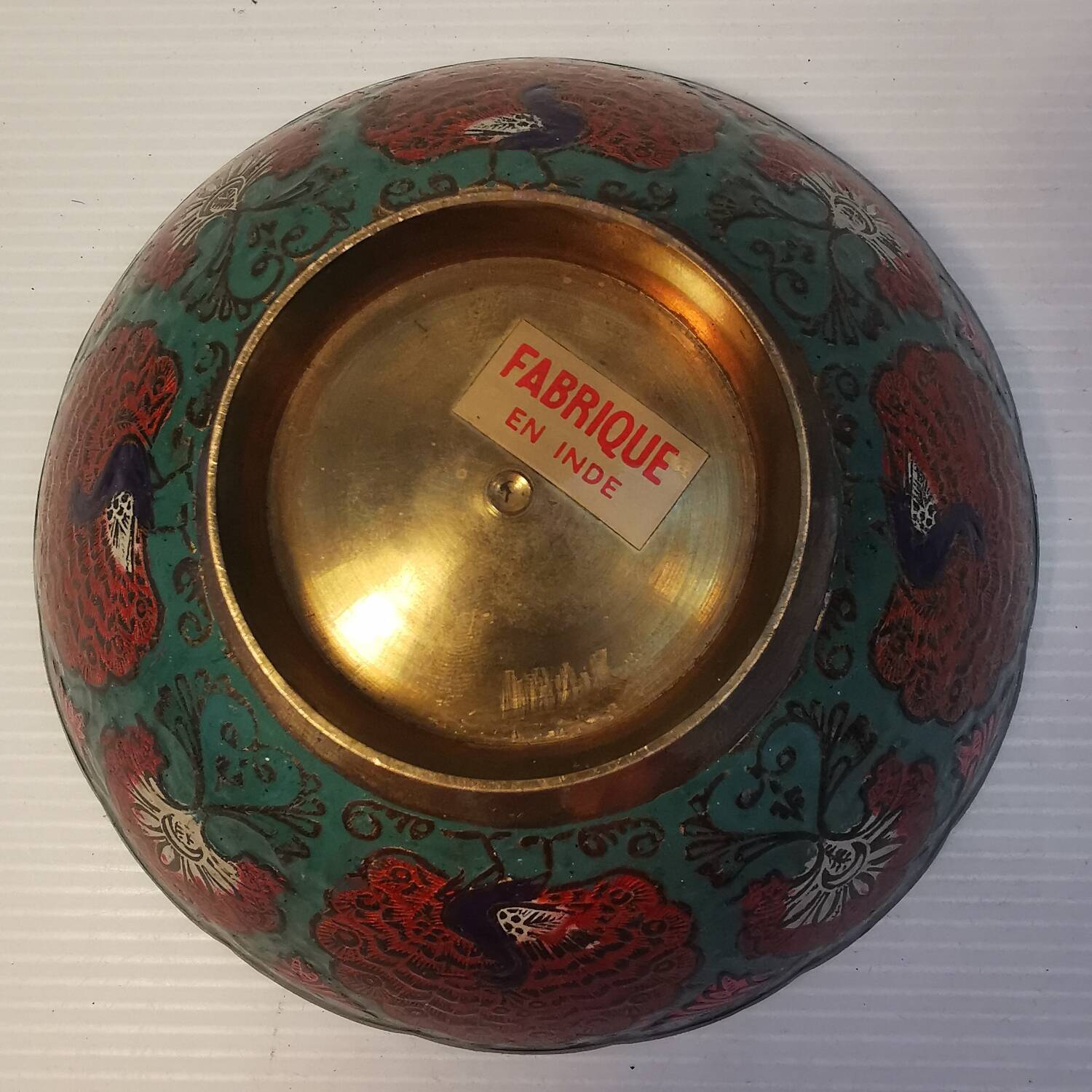 Old Indian brass bowl with peacock decoration