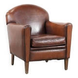 Armchair made of sheepskin leather in art deco design with warm colours