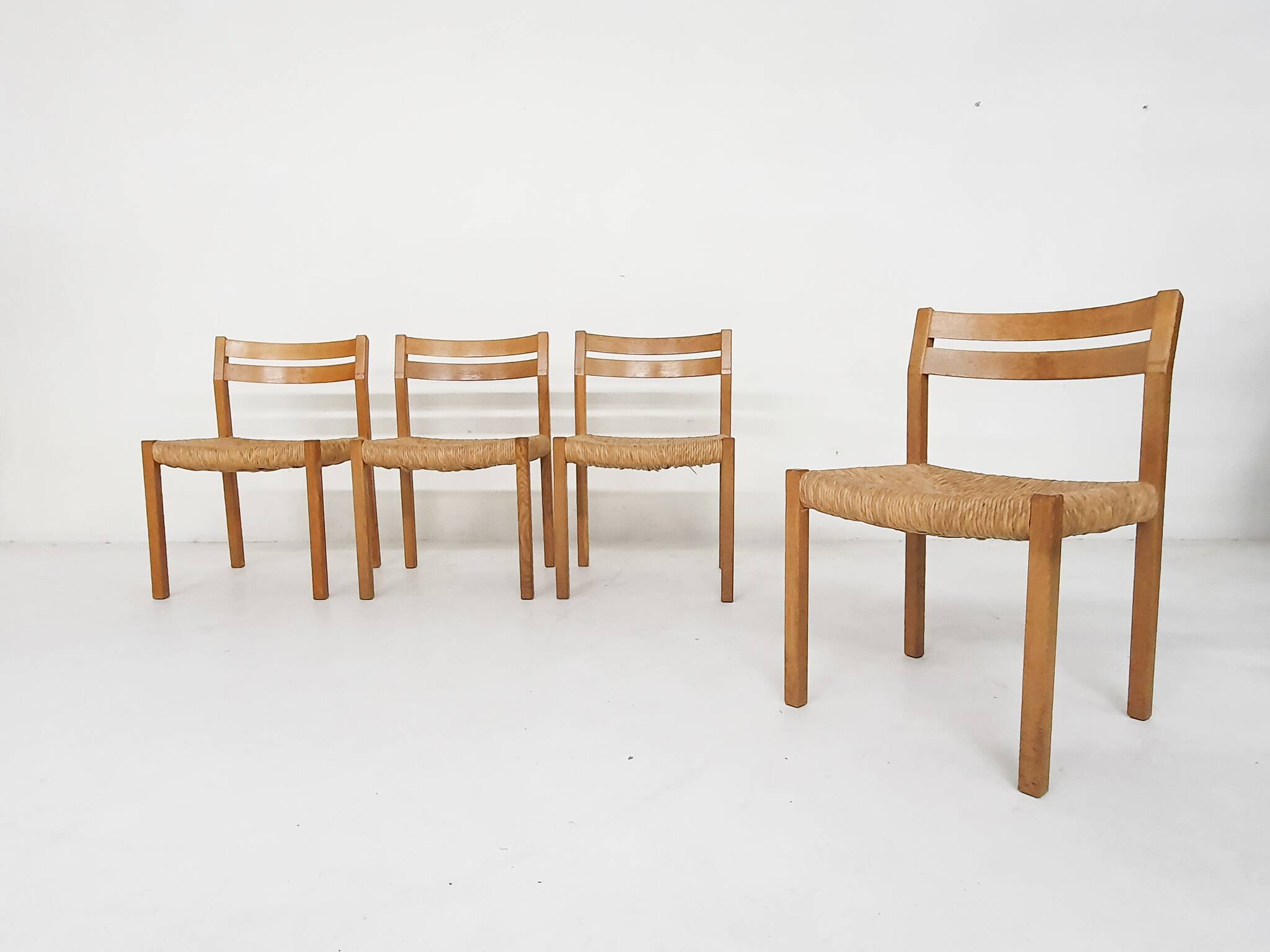 Set of four oak and sisal dining chairs model 401 by JL Moller, Denmark 1970's