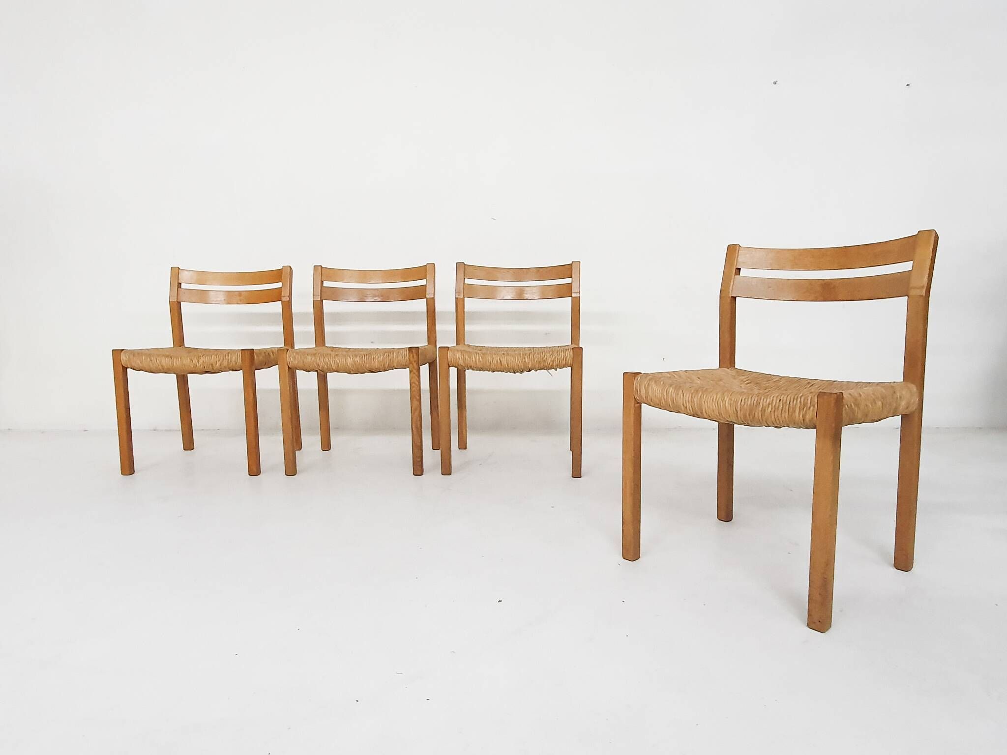 Set of four oak and sisal dining chairs model 401 by JL Moller, Denmark 1970's