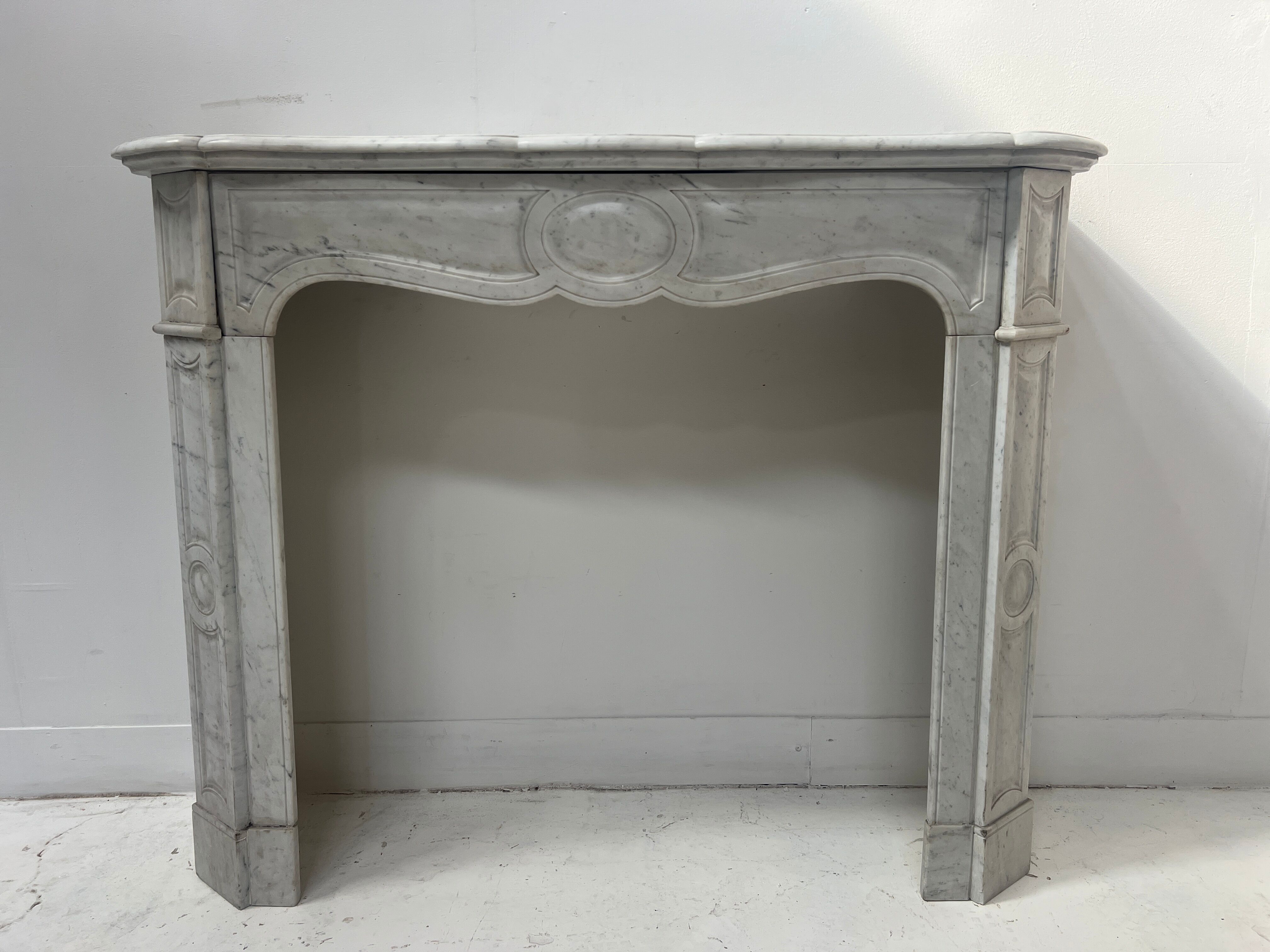 Louis XV style fireplace Model Pompadour White Carrara marble 20th century