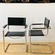 Pair of tubular armchairs in metal and leather Style Marcel Breuer