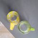 Pair of glass teacups with plastic handles