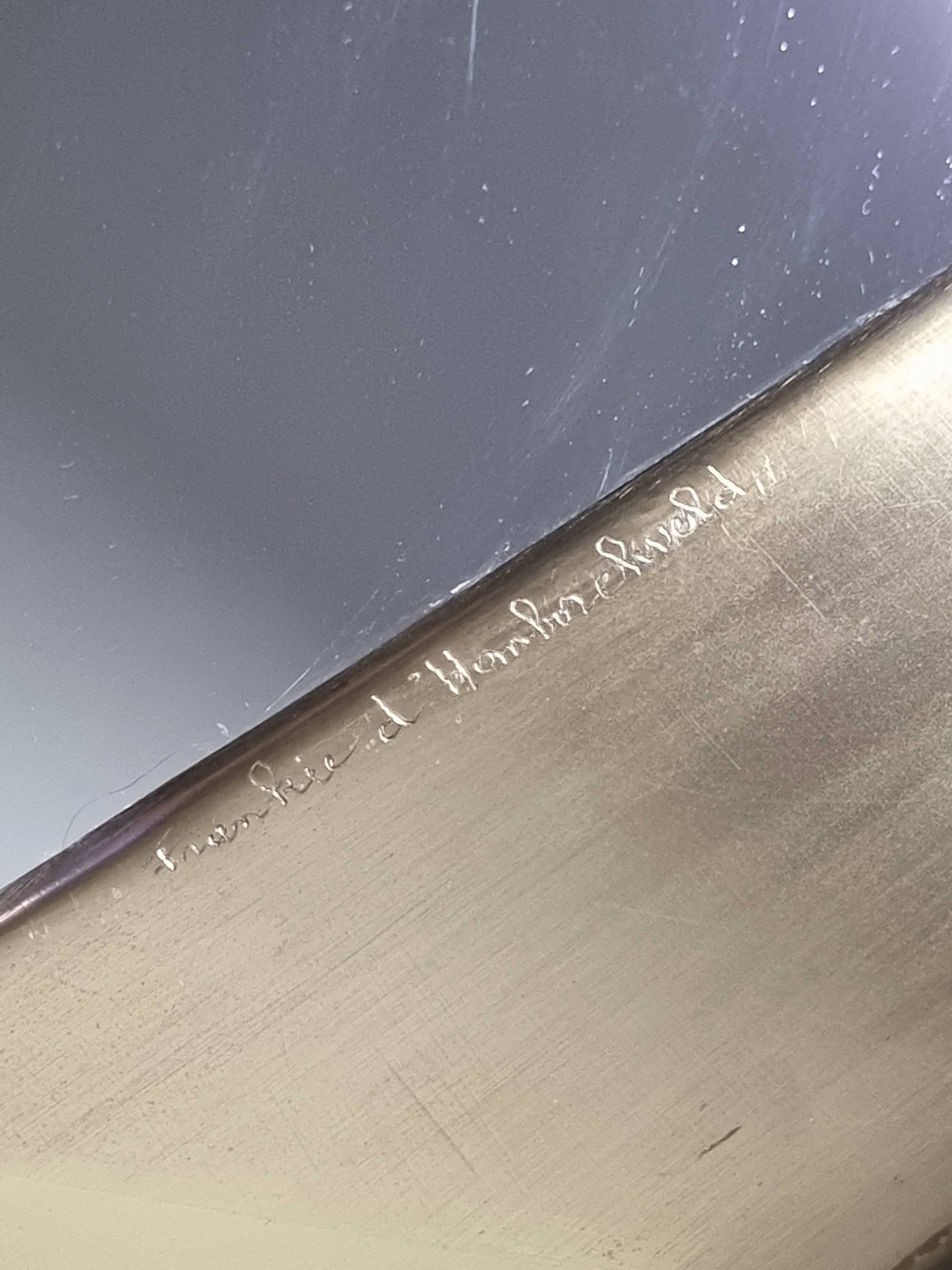 Octagonal brass mirror signed Frankie d'Homborchveld, 47 x 50 cm