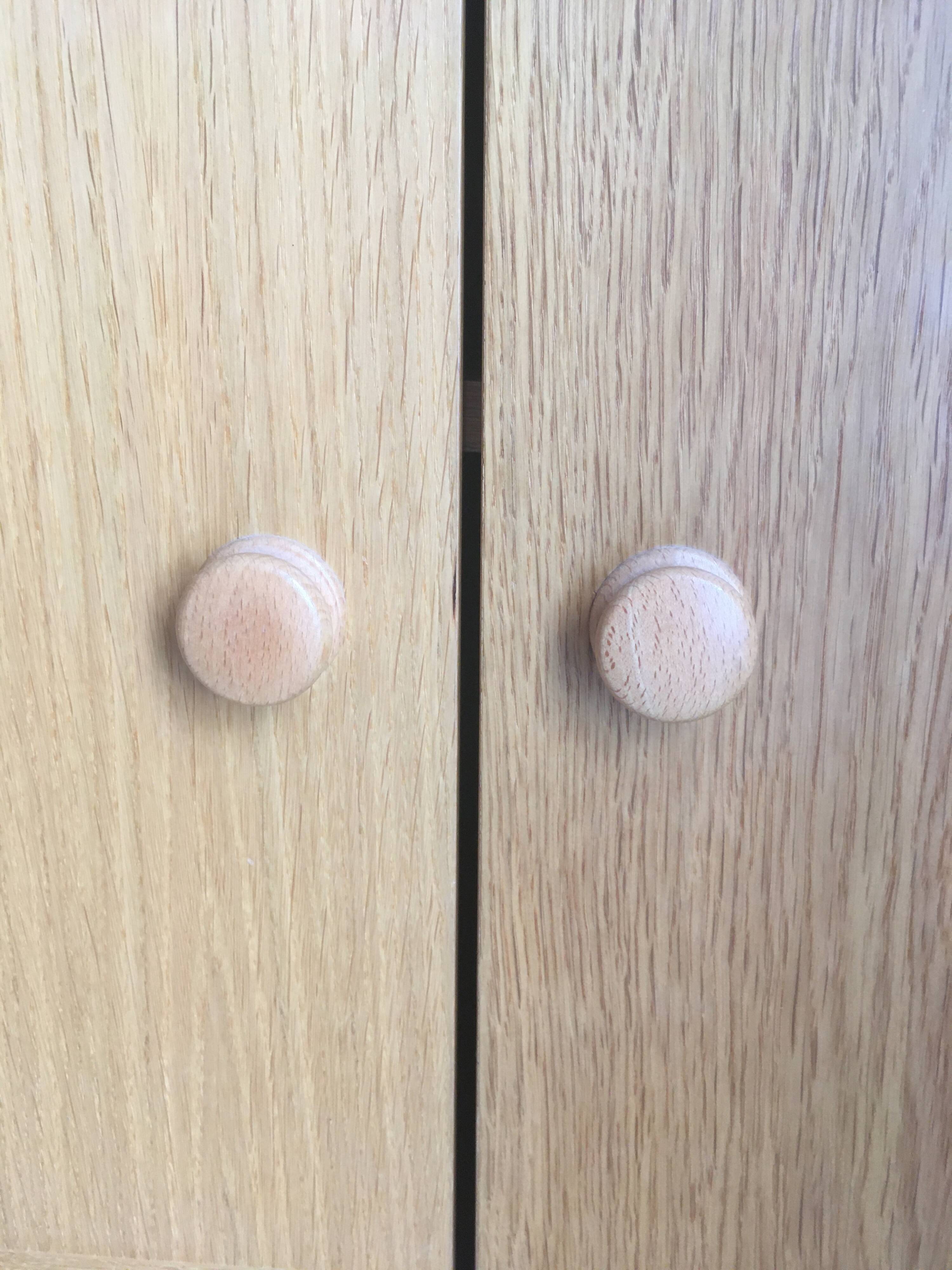 Dressing vintage Scandinavian style in light wood with wardrobe and cupboard.