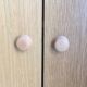 Dressing vintage Scandinavian style in light wood with wardrobe and cupboard.
