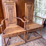 Pair of Renaissance style carved walnut armchairs
