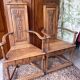 Pair of carved walnut armchairs in Renaissance style