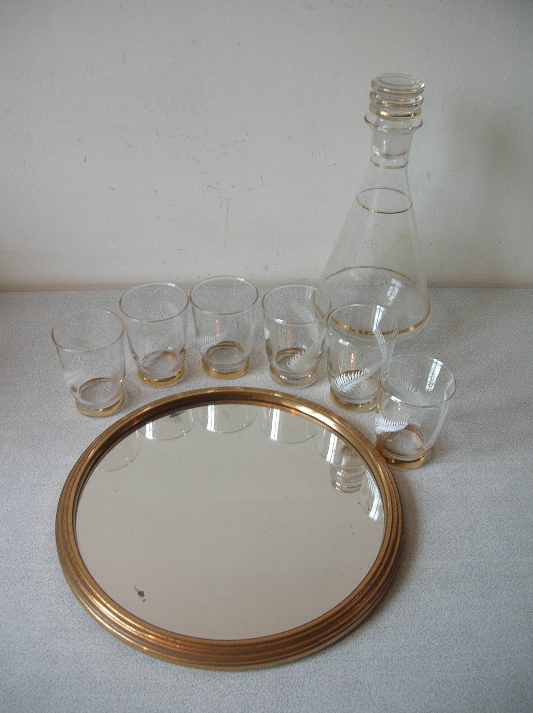 Old glass carafe liquor service with gilding vintage ice mirror tray