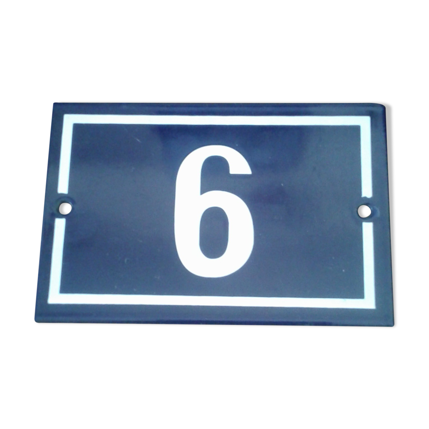 Enamelled street sign bears the number 6