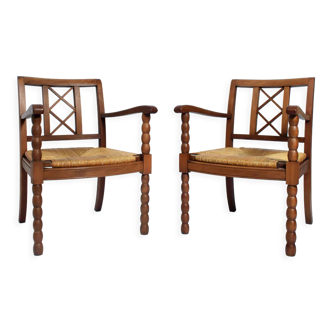 Paire de fauteuils en paille et bois, années 1950