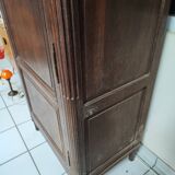 Bonnetière man standing cabinet a door