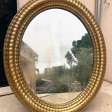 Oval mirror louis XVl with gilded cartouch, napoleon lll, XlXth high 106 cm