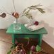 Vintage wooden footrest in mint green.