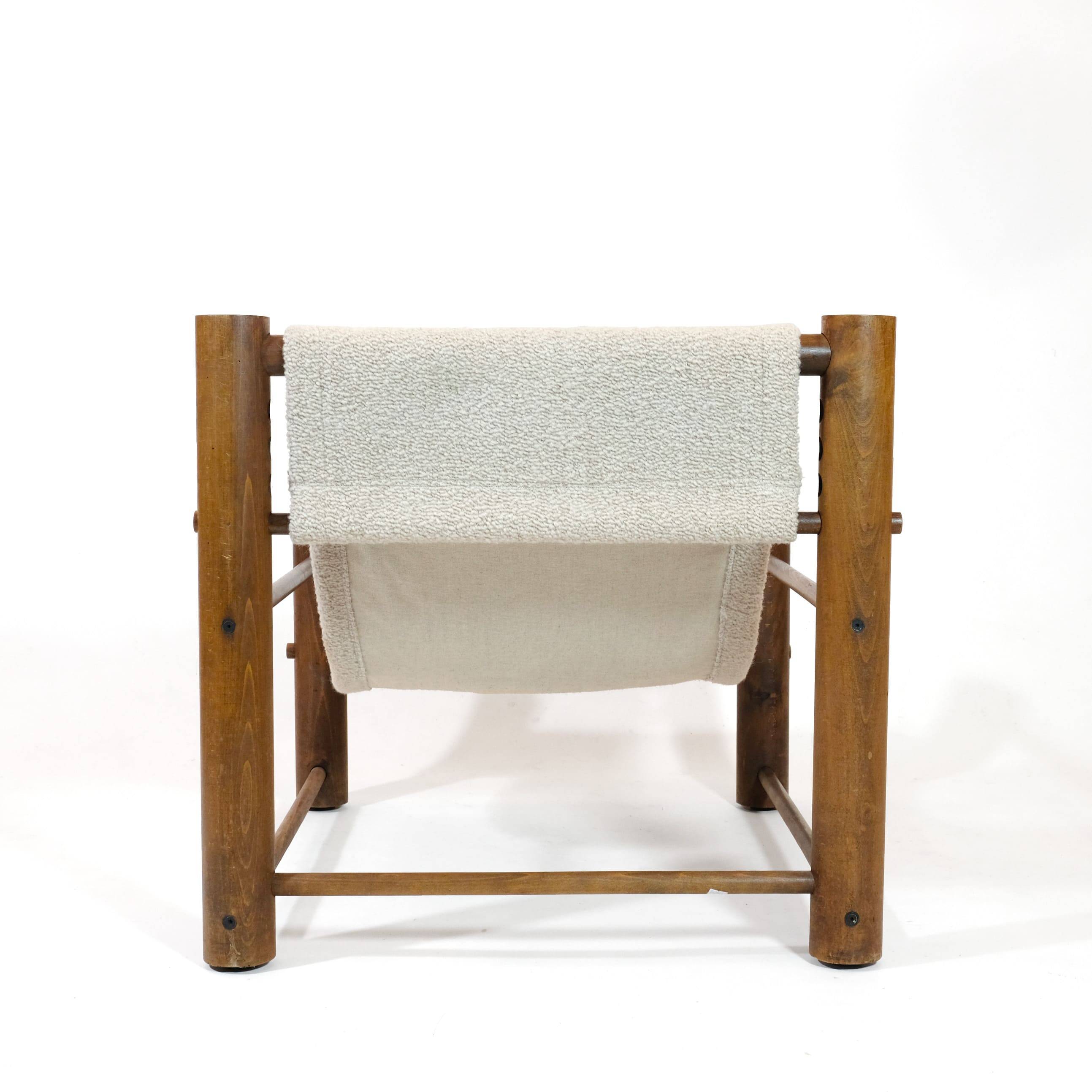 Solid wood armchair with adjustable backrest.
