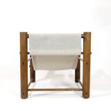 Solid wood armchair with adjustable backrest.