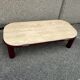 Coffee table Travertine top, garnet-colored metal stand and legs.  Long
