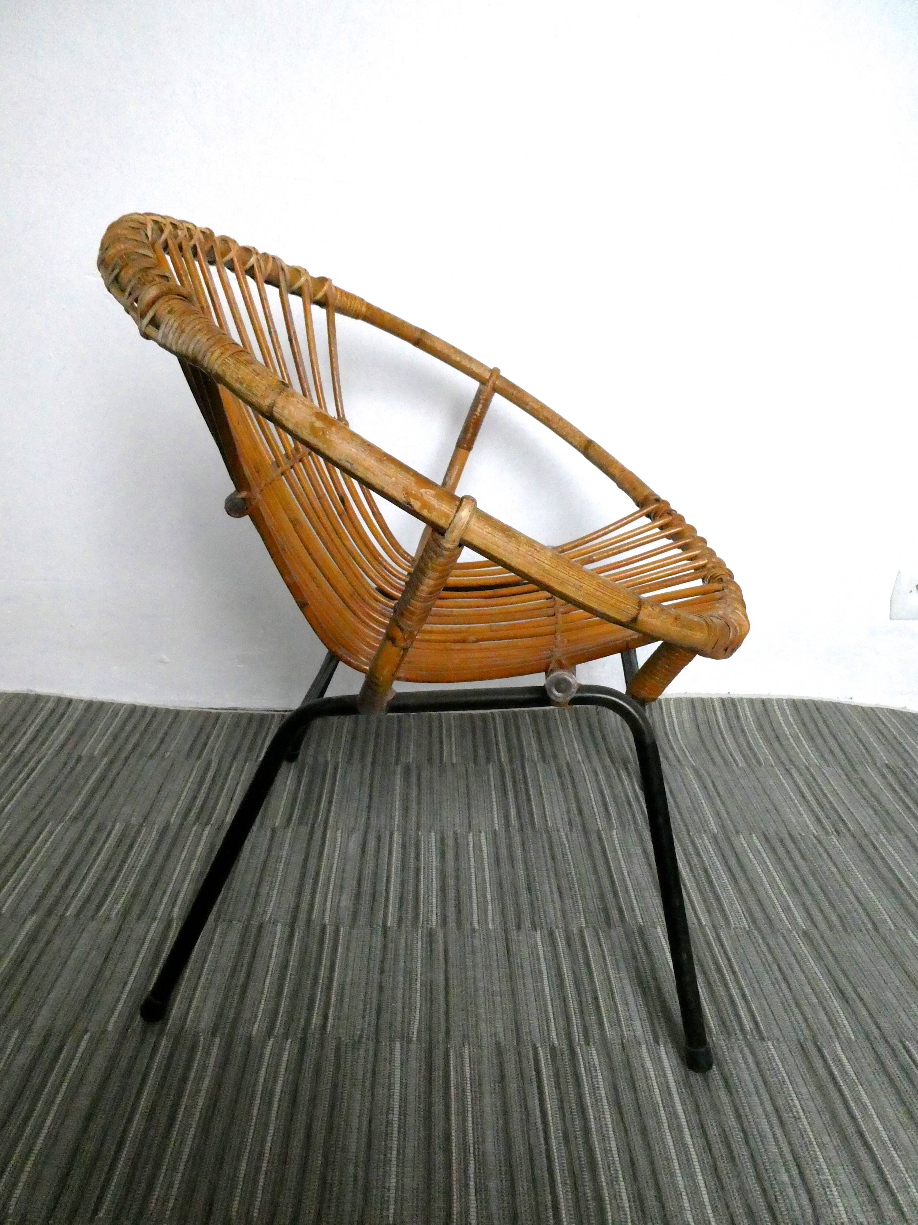 Rattan armchair and 1960s metal feet