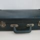 Vintage green cardboard suitcase