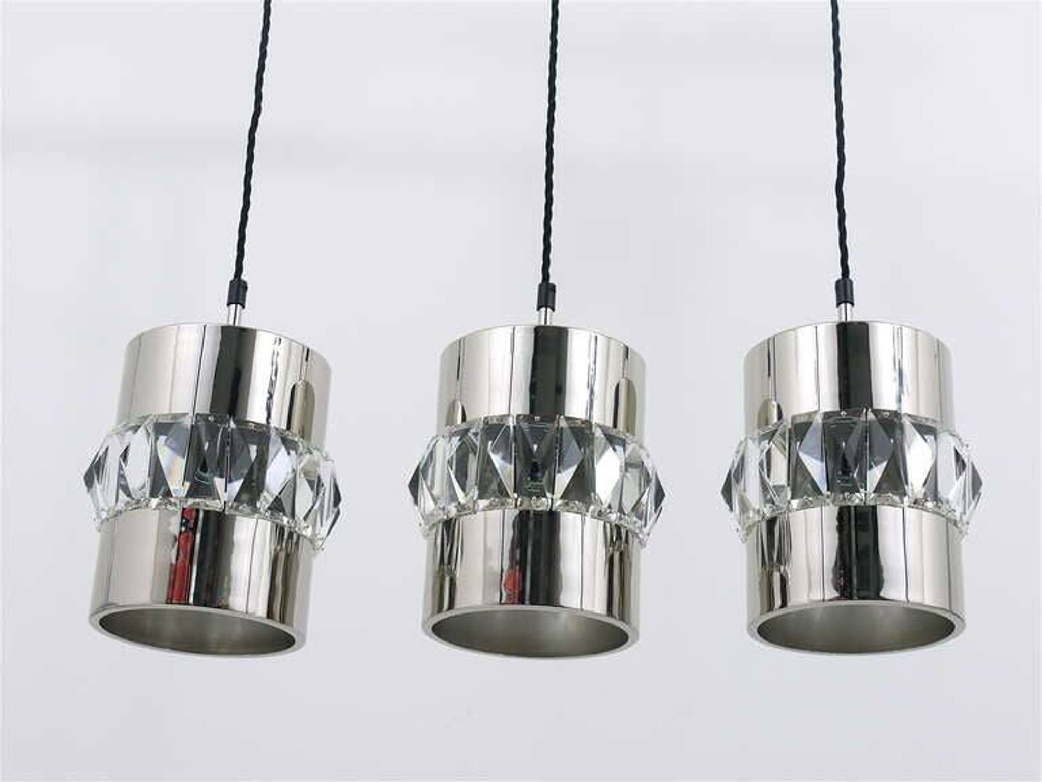 Three Bakalowits pendant lamps in nickel, brass, and faceted crystal, Austria, 1950s.