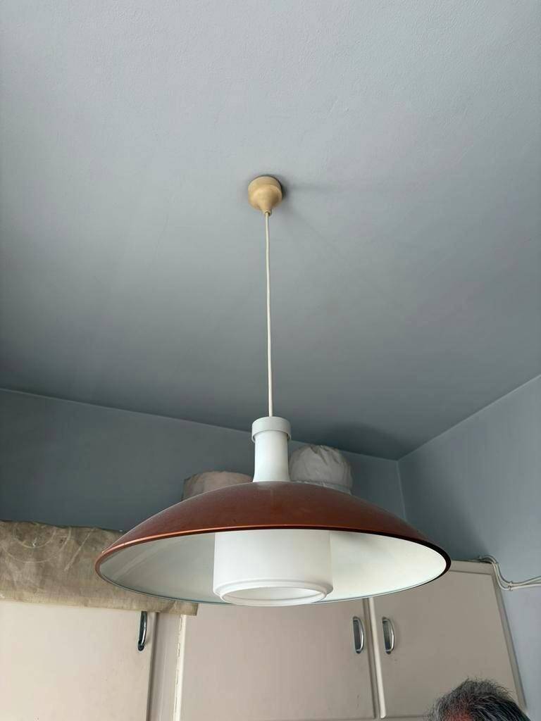 Vintage orange rust metal pendant light with opaline glass.