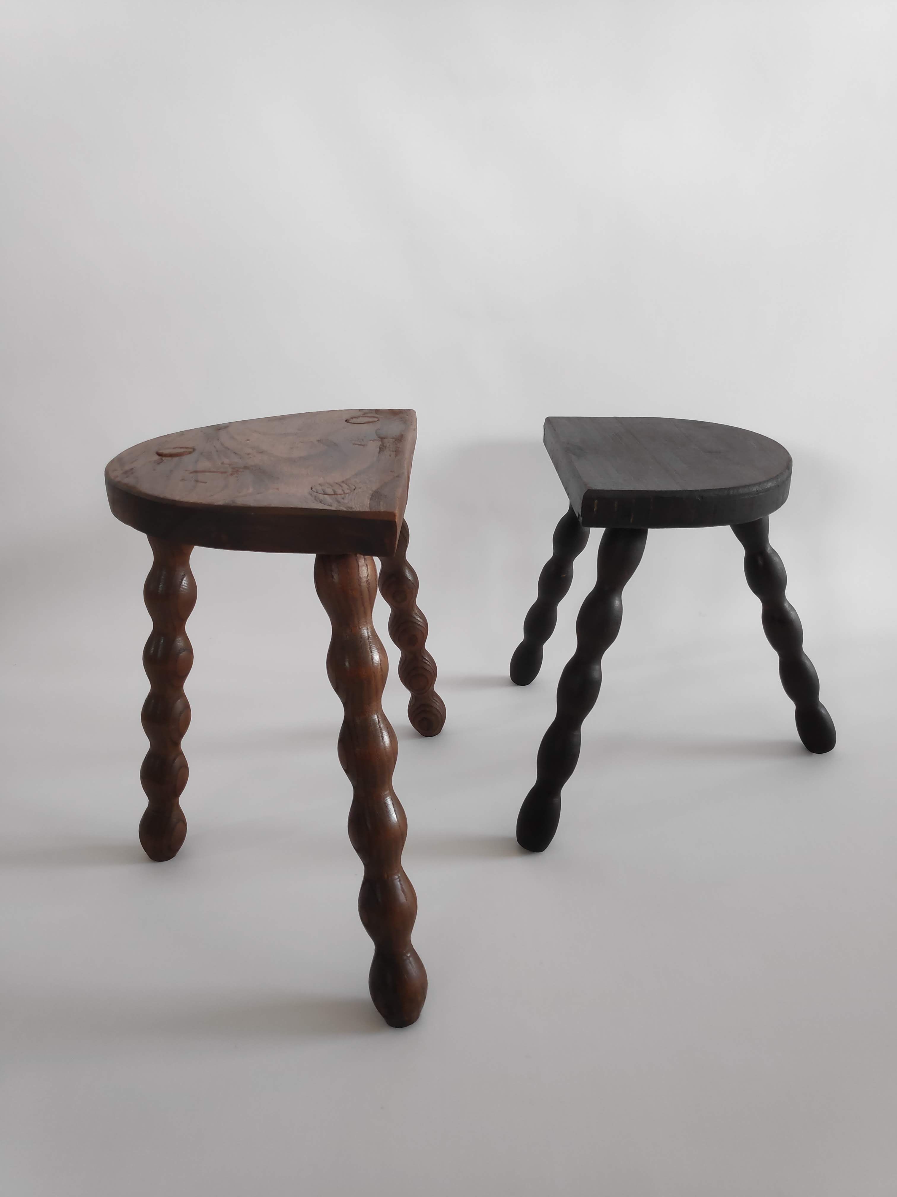 Pair of vintage tripod stools with turned wooden feet