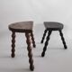 Pair of vintage tripod stools with turned wooden feet