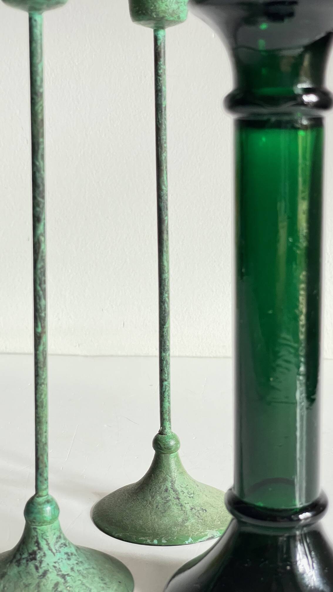 Green glass and metal candle holders
