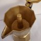 Italian coffee maker in golden alu