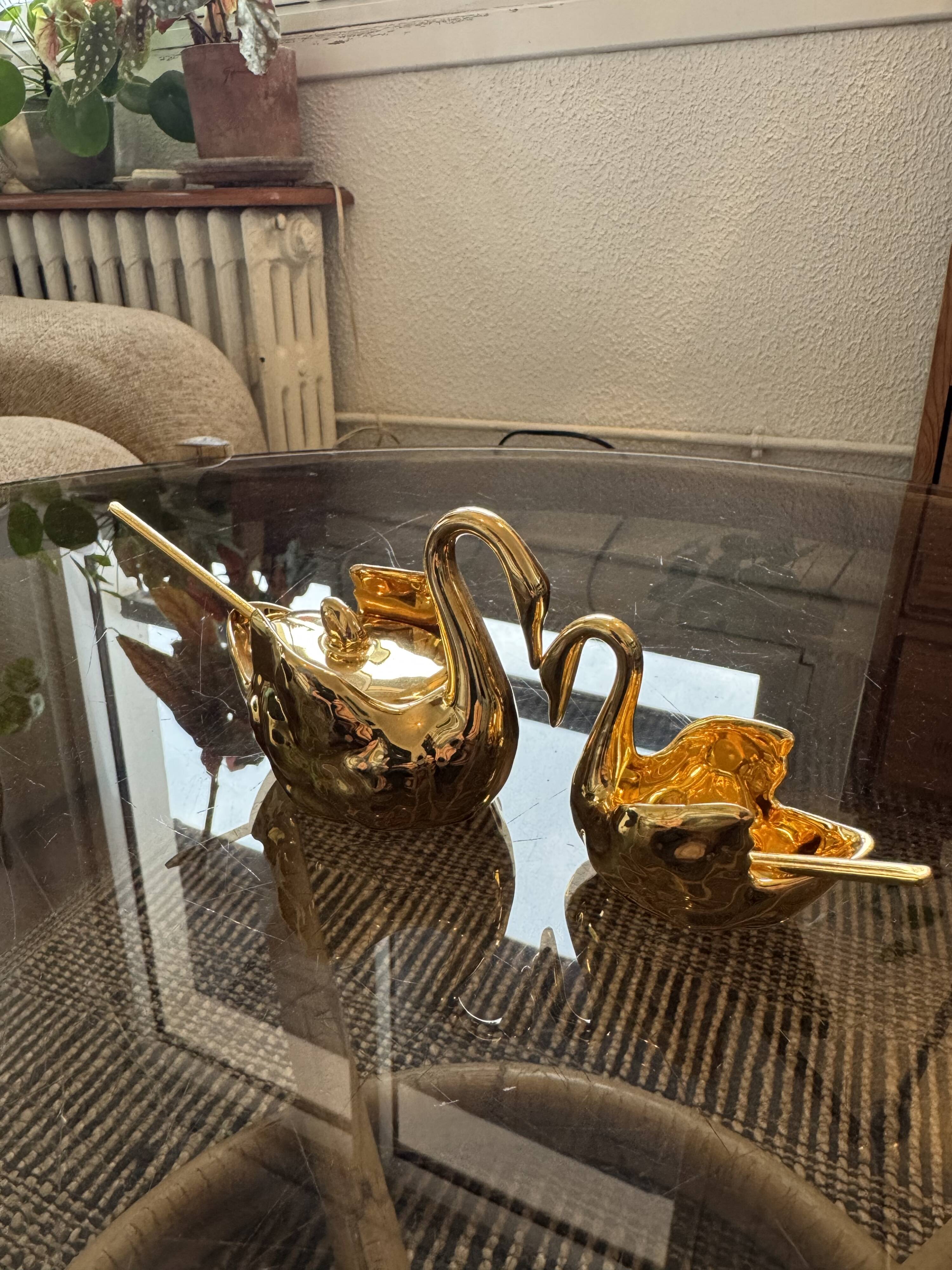 Pair of golden salt cellars in Limoges porcelain shaped like swans