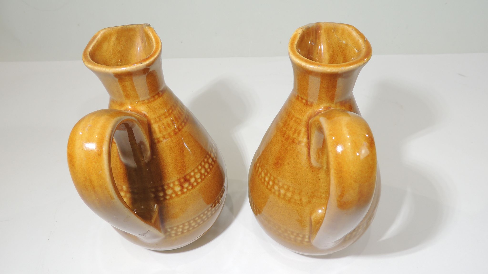Pair of vintage stoneware pitchers