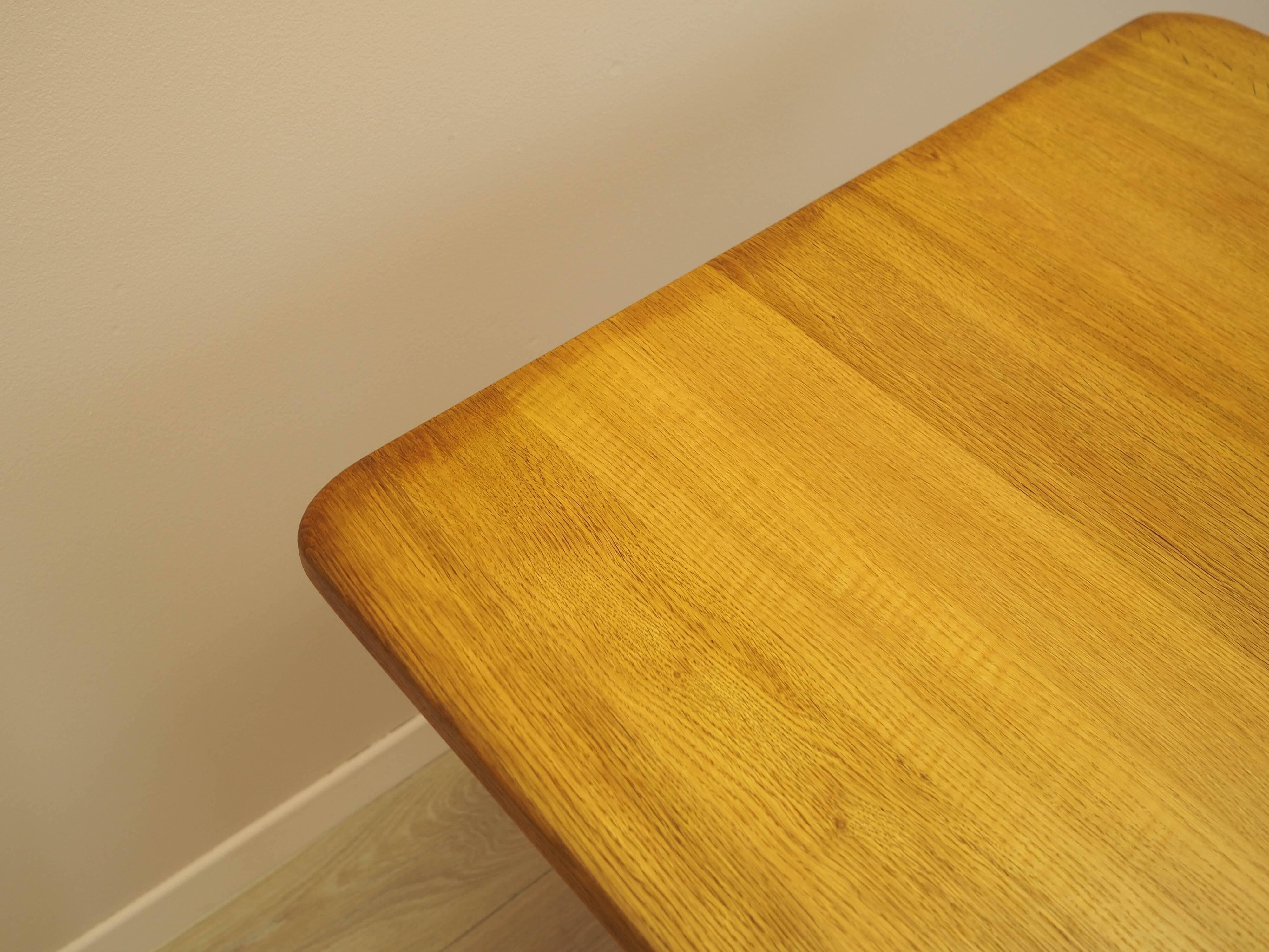 Solid oak dining table by Henning Kjærnulf, Denmark, 1960s