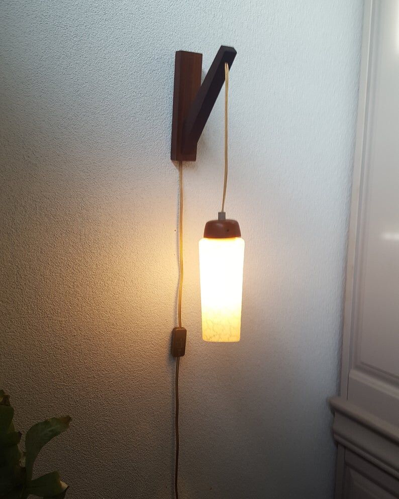 Wooden applique with 60s glass blind