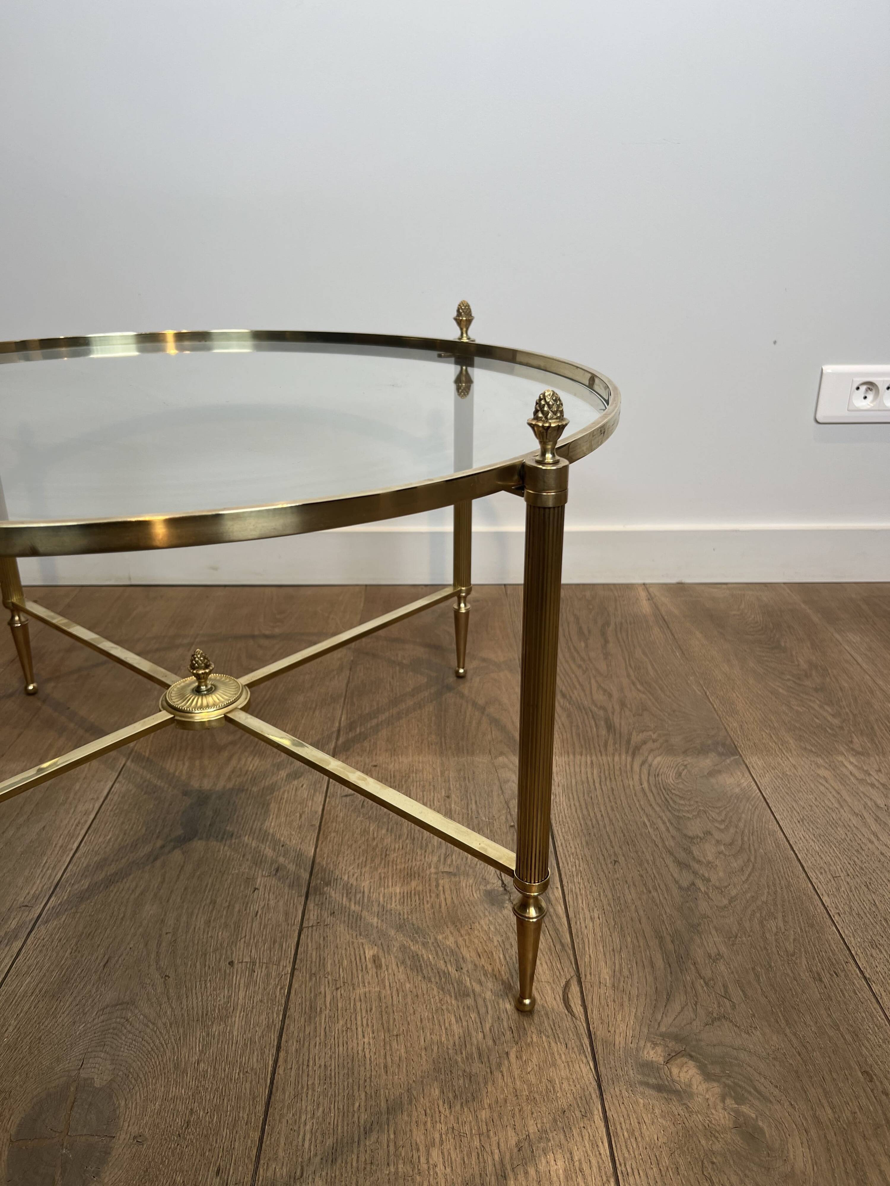Neoclassical Round Coffee Table in Brass with Fluted Supports and Floral Motifs